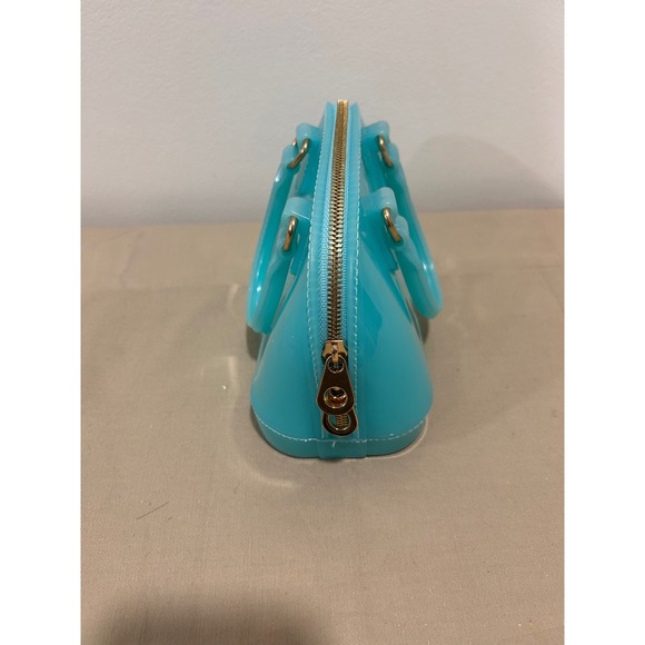 Turquoise handbag is likely a jelly-style mii purse - Picture 3 of 4